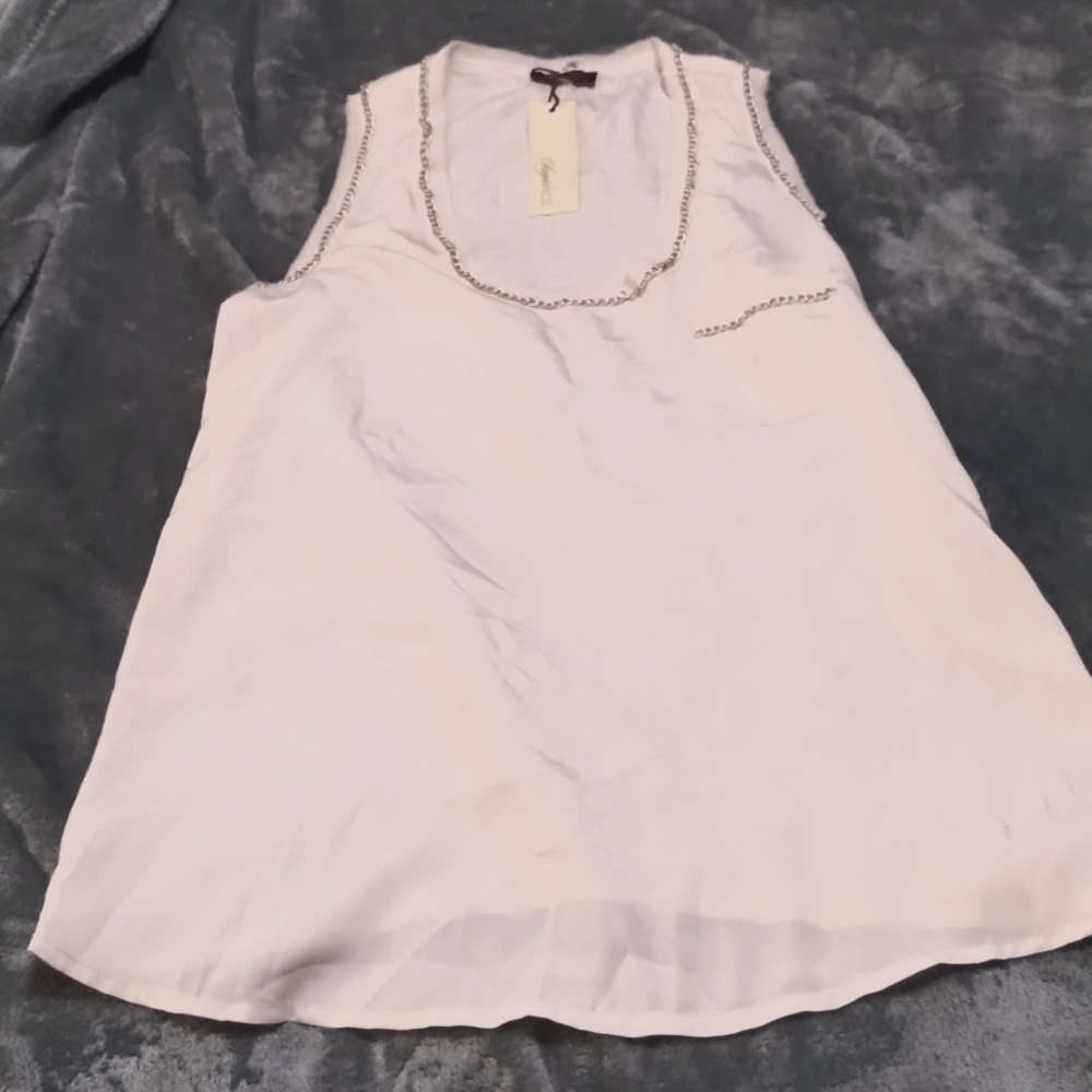 Ivory colored long tank top with sliver chain trim